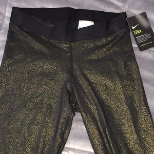 NWT gold and black metallic Nike leggings M